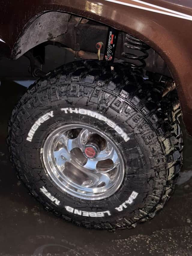 Close detail of one of Brownie's Mickey Thompson Baja Legend tires on a polished wheel