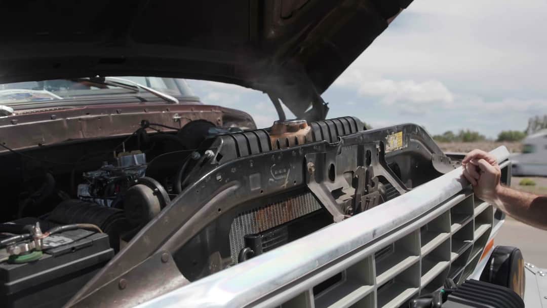 Brownie's open engine bay and radiator on the roadside during a cooling-system check halfway across Route 66.